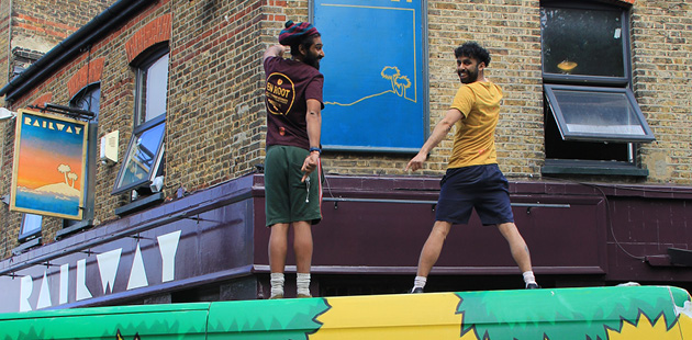 Brothers on van outside pub new business