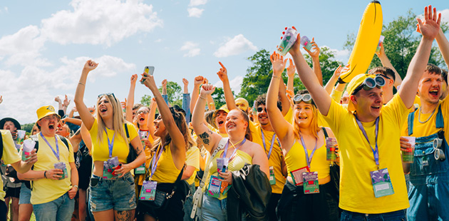 Bar team celebrate at festival in the sun